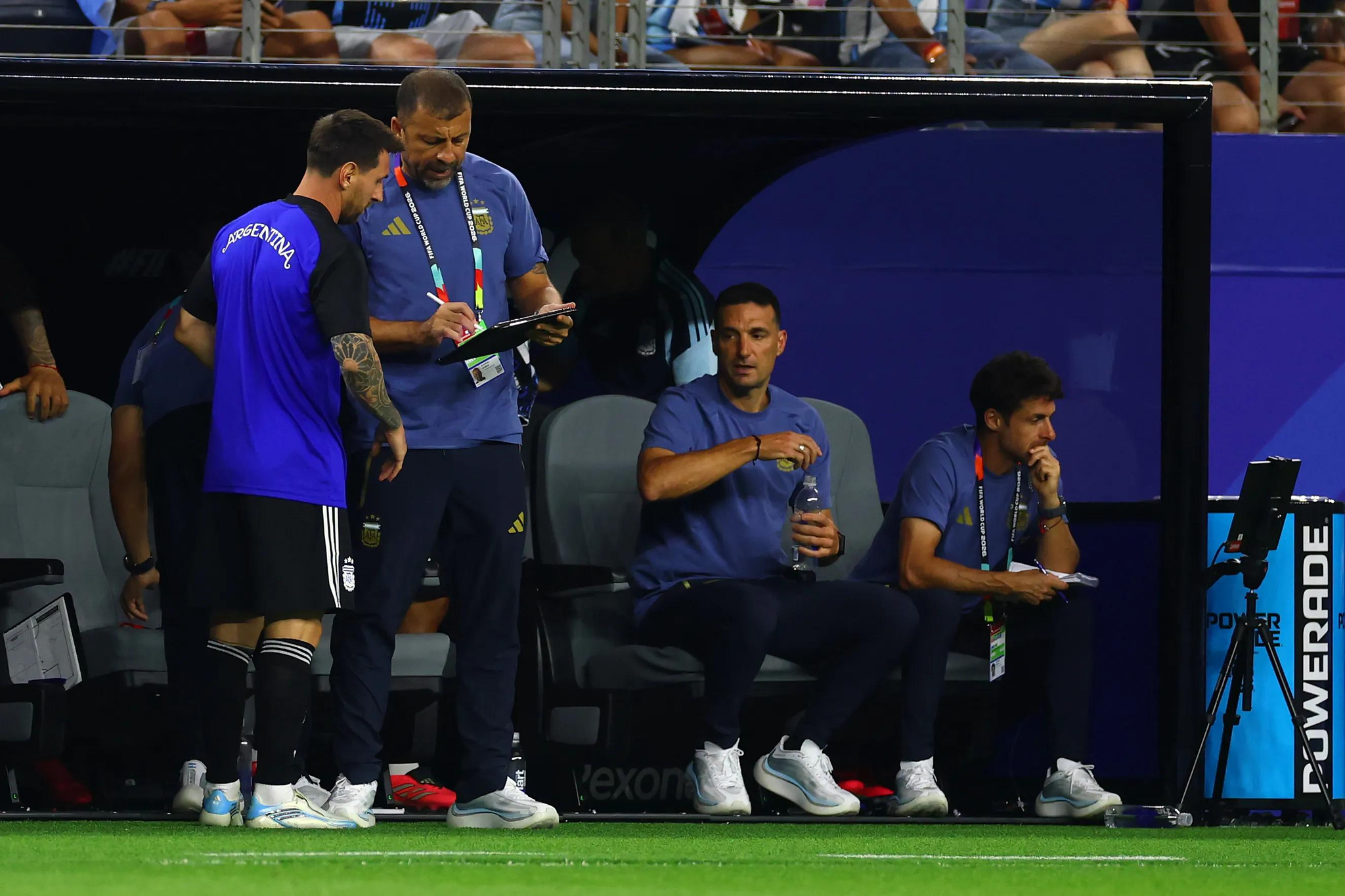 ARLINGTON, TEXAS - JUNE 27: Lionel Messi of Argentina receives instructions from assistant coach Walter Samuel before entering the field during the FIFA World Cup 2026 Group J match between Jordan and Argentina at Dallas Stadium on June 27, 2026 in Dallas, United States. (Photo by Chris Brunskill/Fantasista/Getty Images)