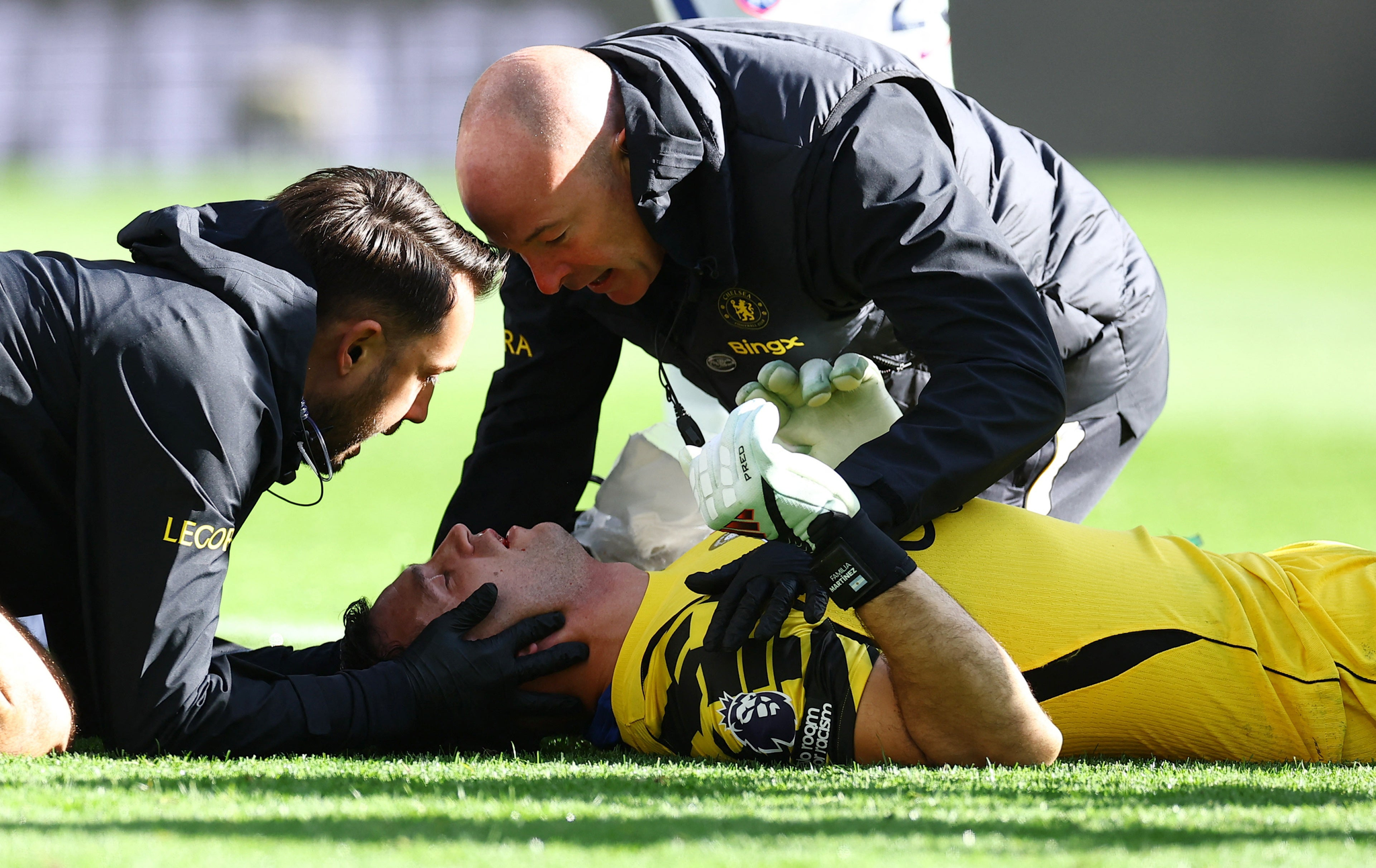 Chelsea's Emiliano Martinez receives medical attention after sustaining a head injury